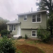 Green siding exterior before curb appeal upgrade
