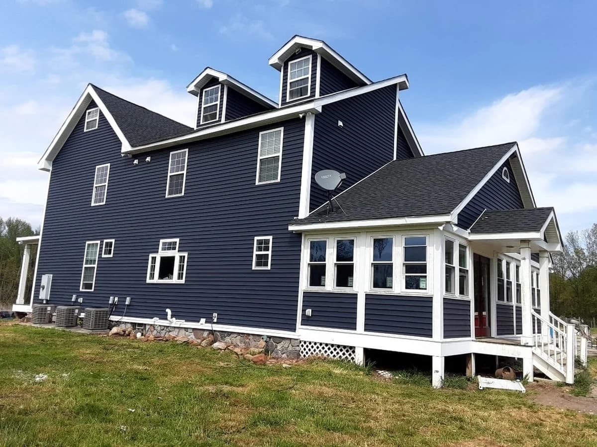 Deluxe Siding checking siding, trim, and window details